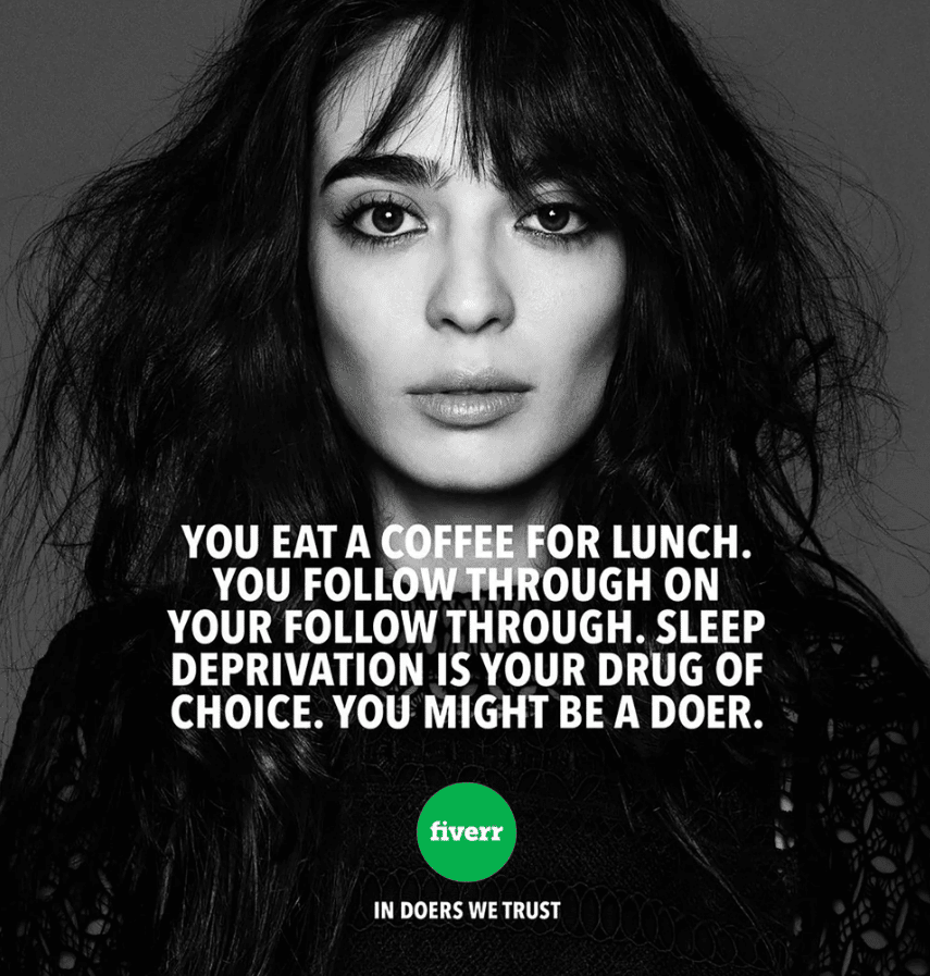 A grayscale photo of a harried-looking woman looking straight at the camera with the caption: "You eat a coffee for lunch. You follow through on your follow through. Sleep deprivation is your drug of choice. You might be a doer.". Below that, in a smaller font: "In doers we trust".