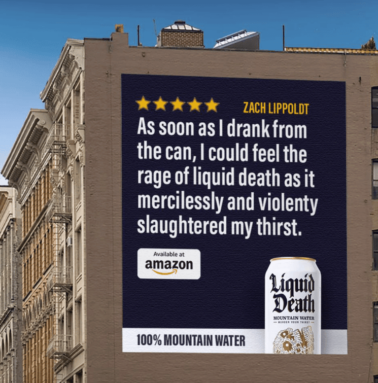 Huge Liquid Death's ad on the side of a building with a five star review from Zach Lippoldt: "As soon as I drank from the can, I could feel the rage of liquid death as it mercilessly and violently slaughtered my thirst."